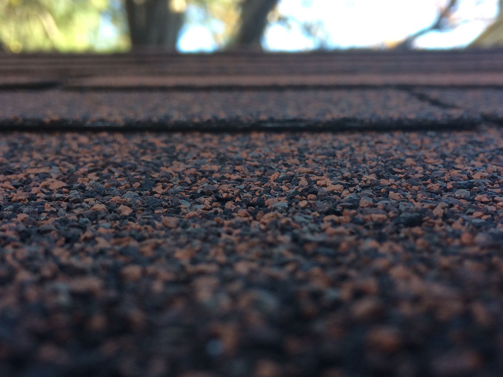 New roof installation showing fresh shingles and professional workmanship with detailed craftsmanship